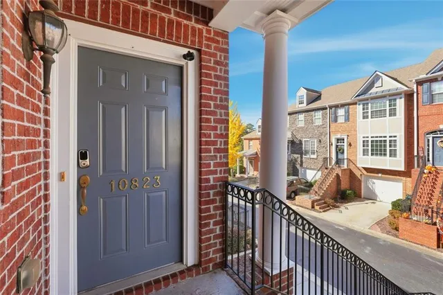 a view of a brick house with a large window