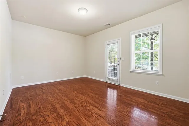 an empty room with wooden floor
