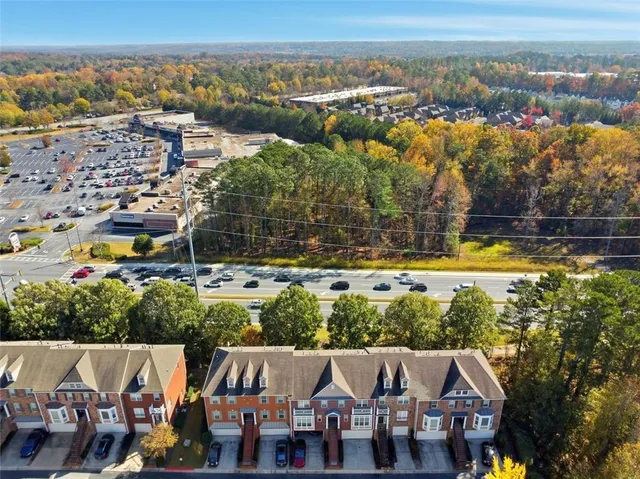 an aerial view of residential houses with outdoor space