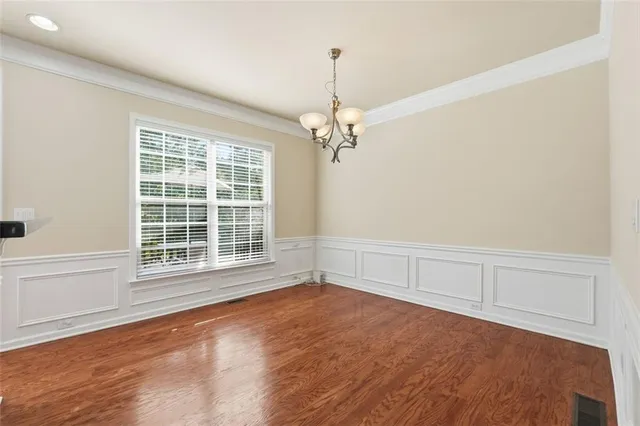 a view of a livingroom with an empty space and a window