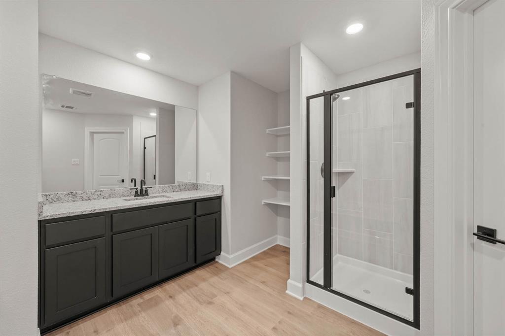 809 Princeton Hts Boulevard Princeton, TX 75407 - Photo 5 of 10 a bathroom with a double vanity sink mirror and shower
