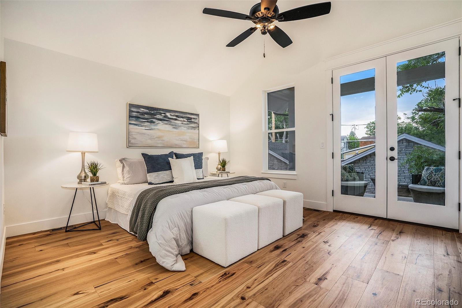 3271 Perry Street Denver, CO 80212 - Photo 14 of 34 a bedroom with a bed and wooden floor