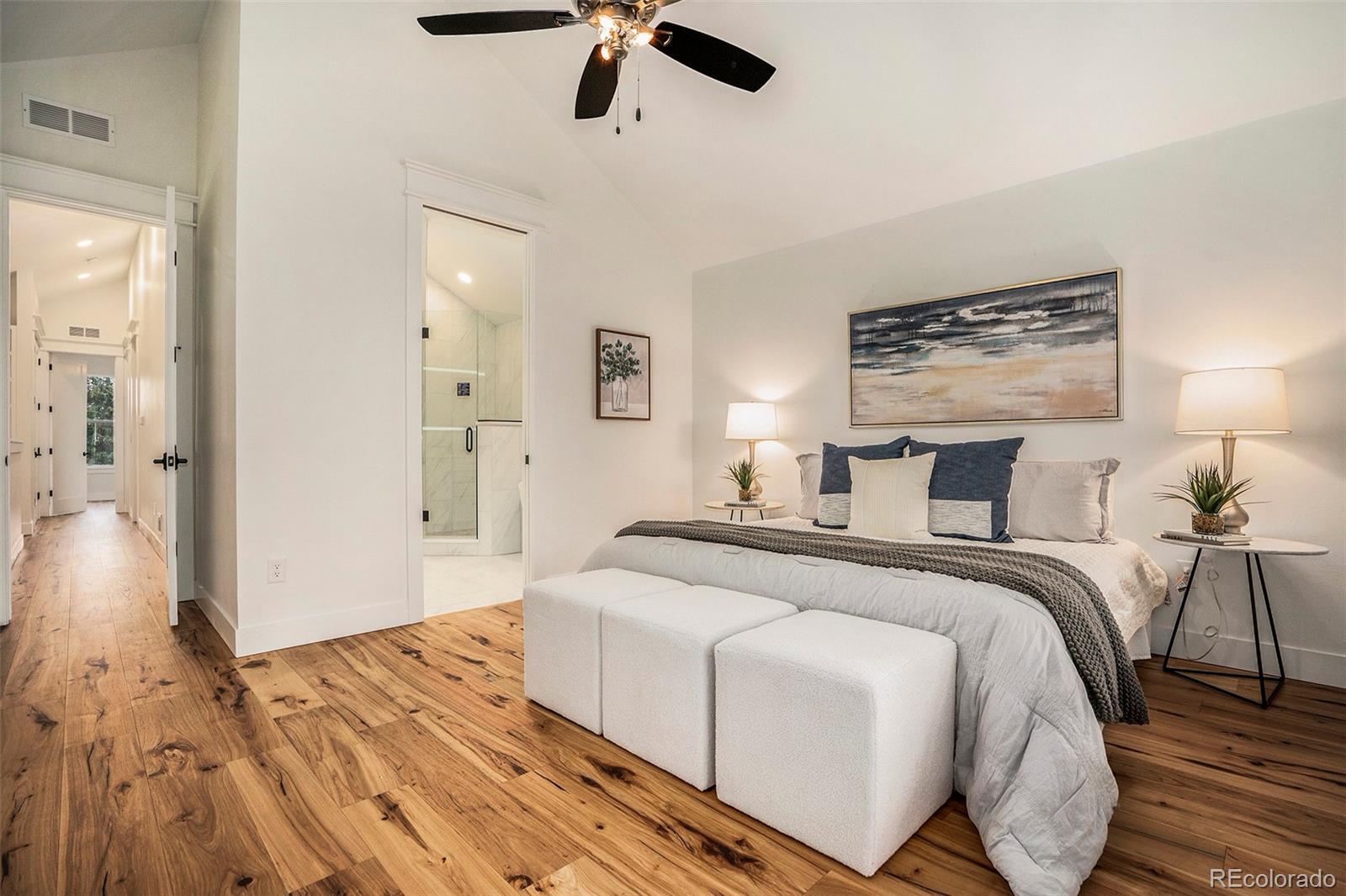3271 Perry Street Denver, CO 80212 - Photo 15 of 34 a spacious bedroom with a bed and wooden floor