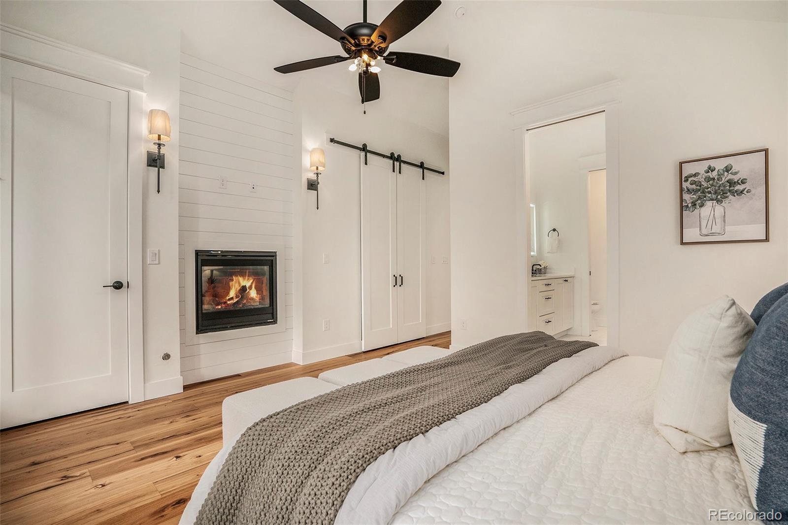 3271 Perry Street Denver, CO 80212 - Photo 16 of 34 a bedroom with a bed and a chandelier