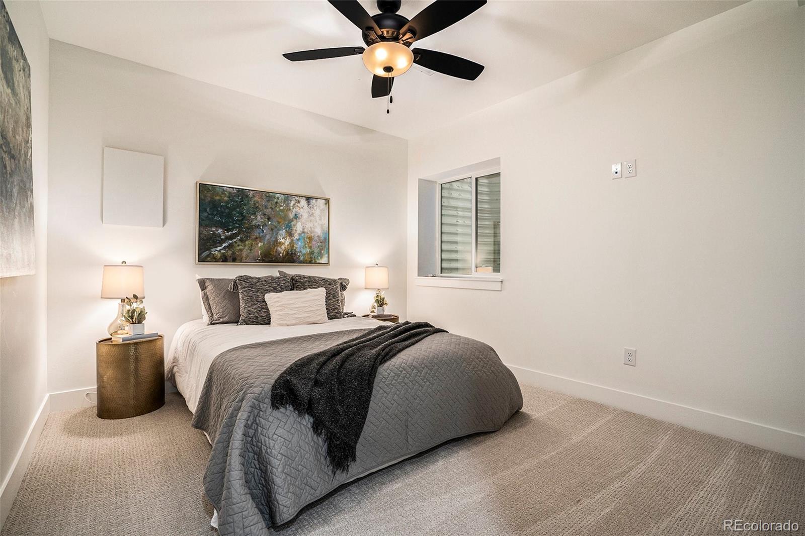 3271 Perry Street Denver, CO 80212 - Photo 31 of 34 a bedroom with a bed and a flat screen tv