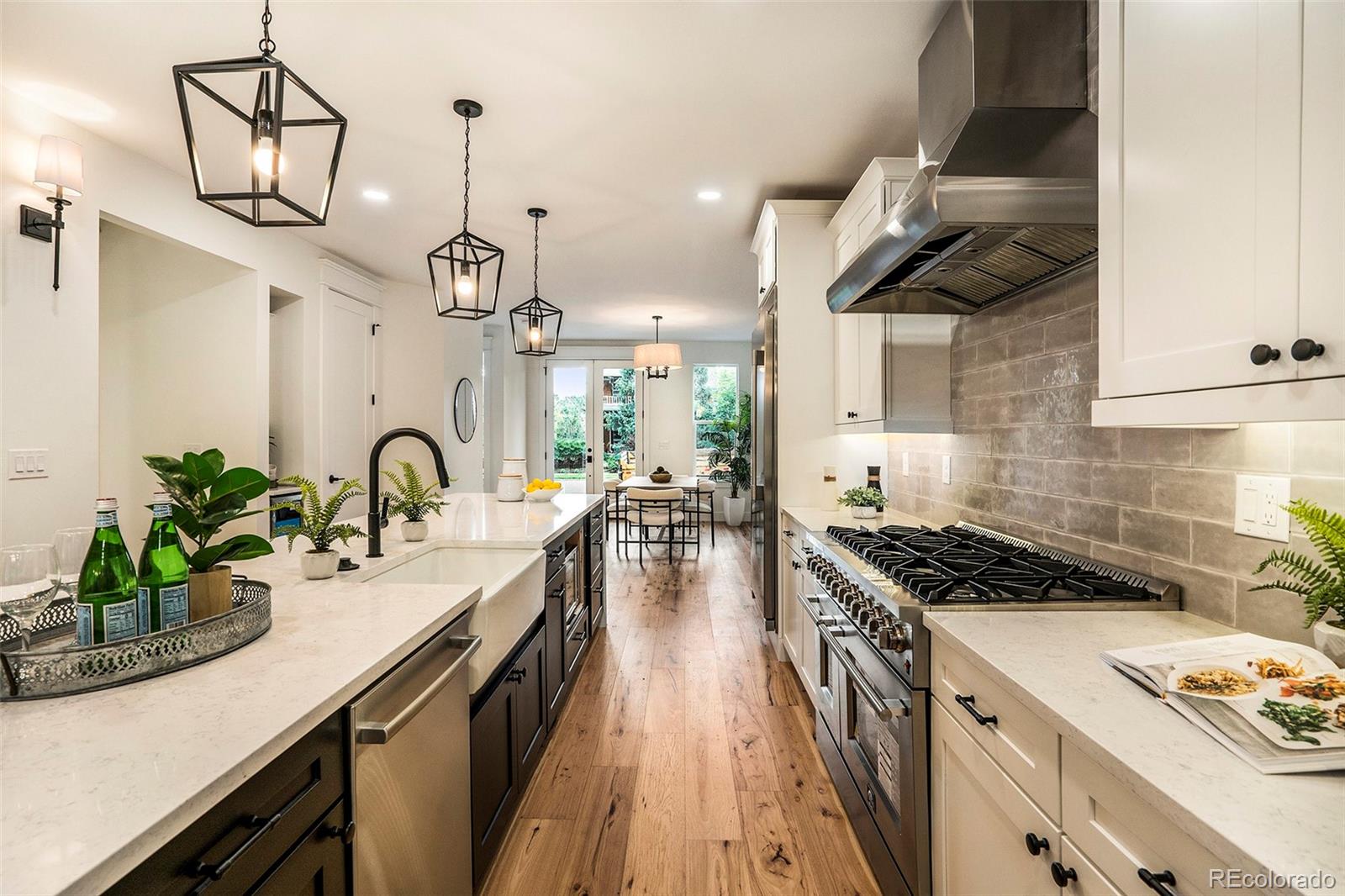 3271 Perry Street Denver, CO 80212 - Photo 9 of 34 a kitchen with sink stove and cabinets