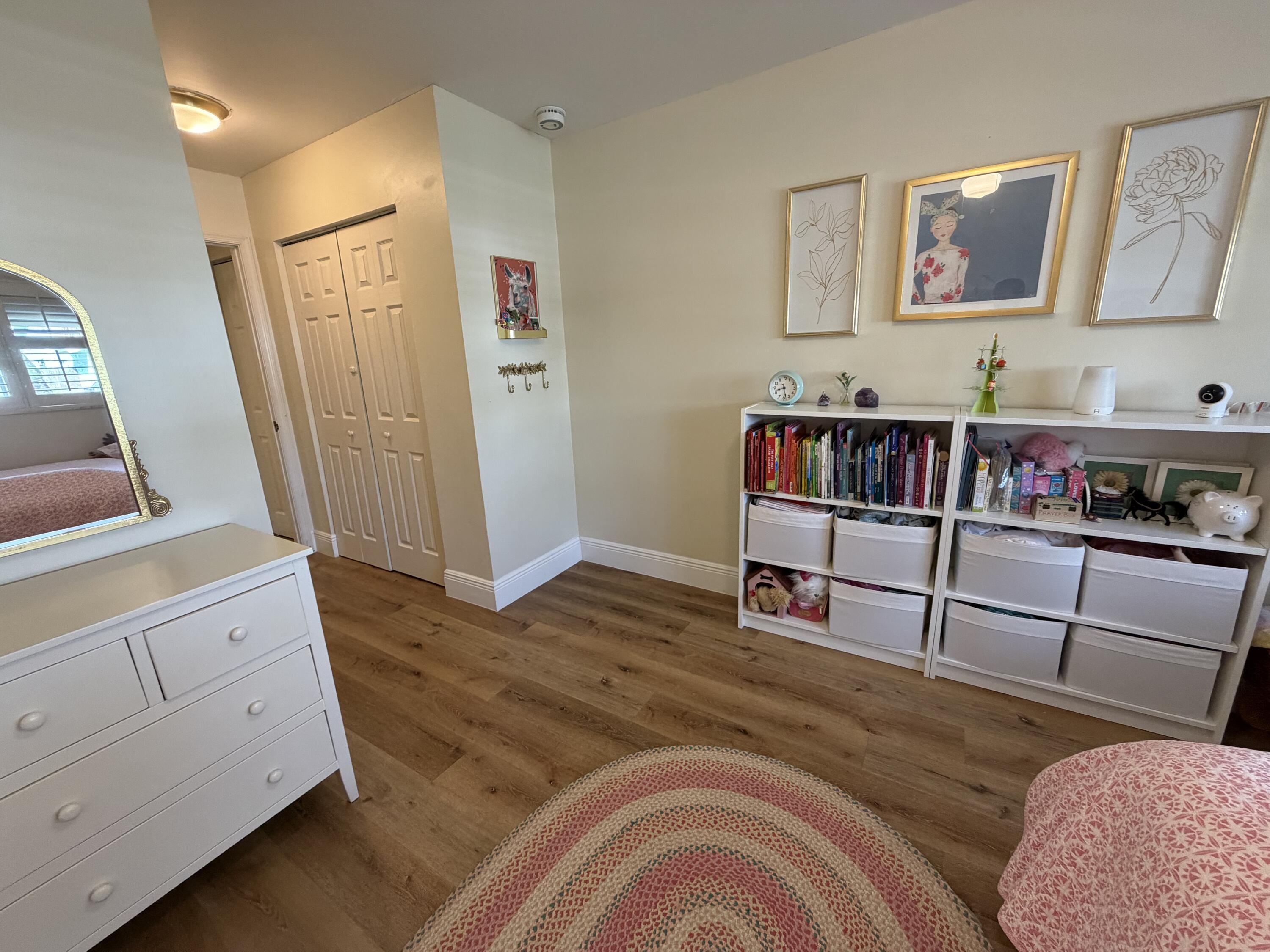 236 Southeast 9th Street Dania, FL 33004 - Photo 14 of 25 a bedroom with furniture and a wooden floor