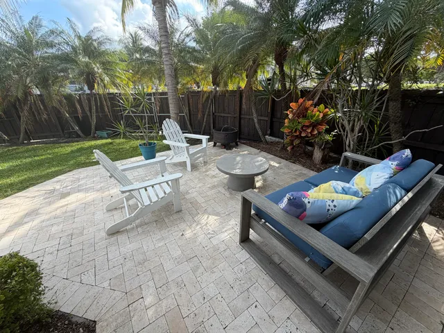 a view of a park with a house in the background