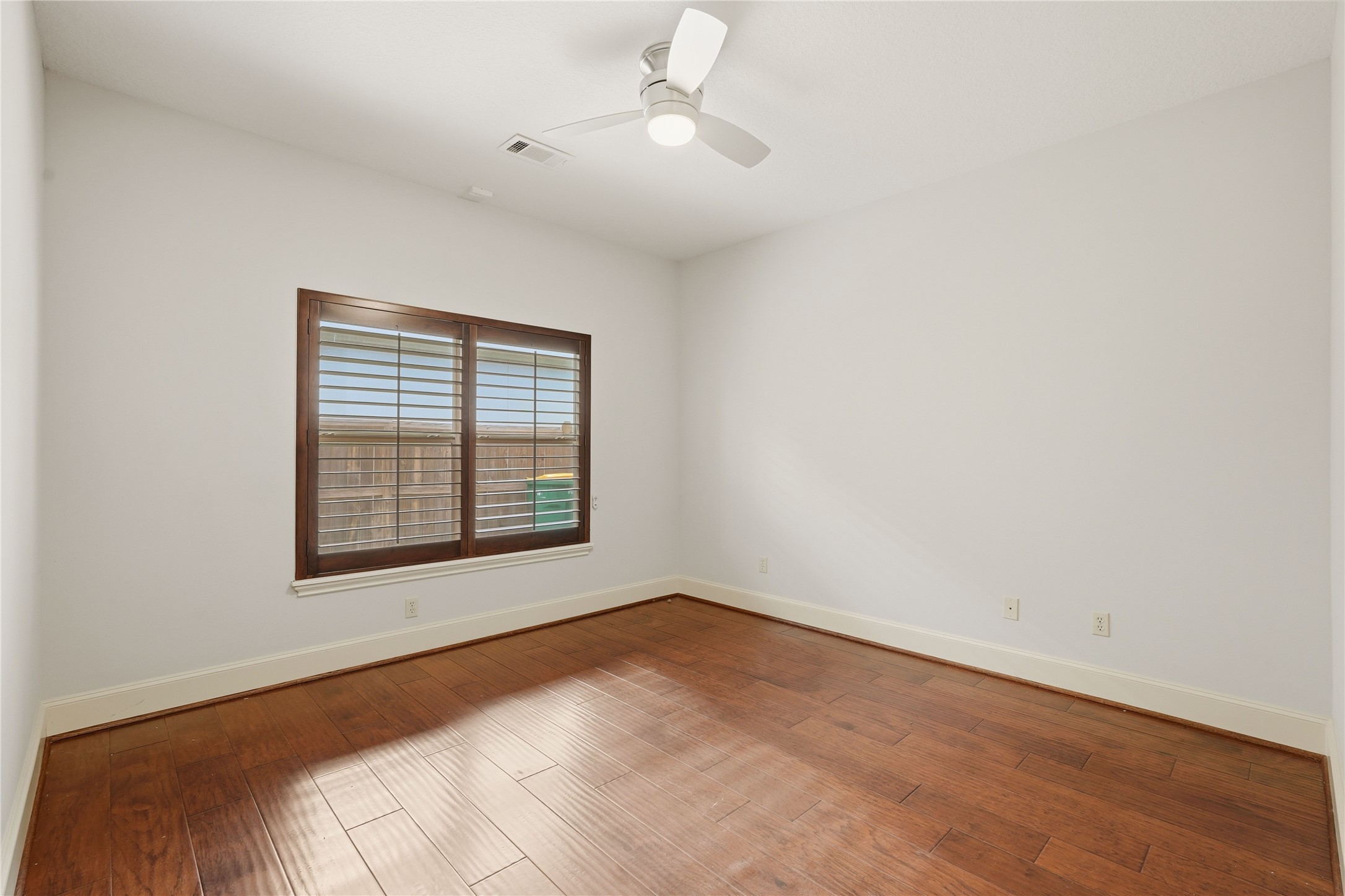 8111 Hideaway Lake Circle Spring, TX 77389 - Photo 35 of 48 an empty room with a window and ceiling fan