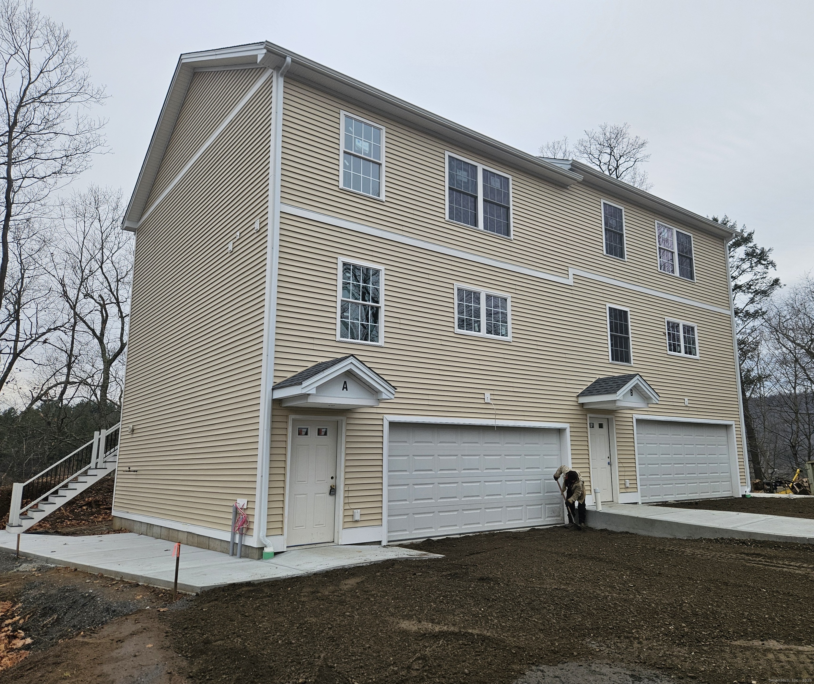 43 Fairfield Place, Unit B Beacon Falls, CT 06403 - Photo 1 of 1 a front view of a house with a yard
