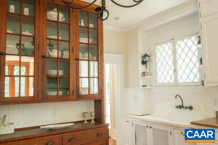 1326 Rugby Road Charlottesville, VA 22903 - Photo 14 of 65 a bathroom with a sink and a mirror
