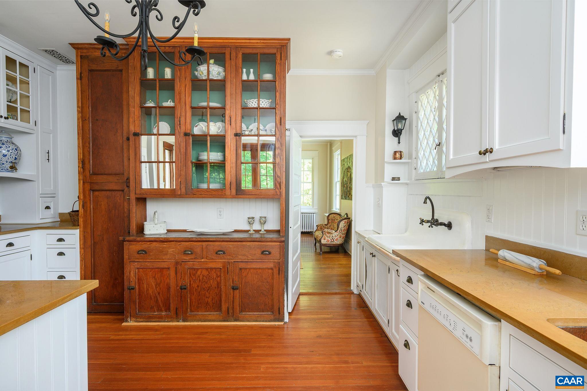 1326 Rugby Road Charlottesville, VA 22903 - Photo 15 of 65 a large kitchen with stainless steel appliances granite countertop a sink and cabinets