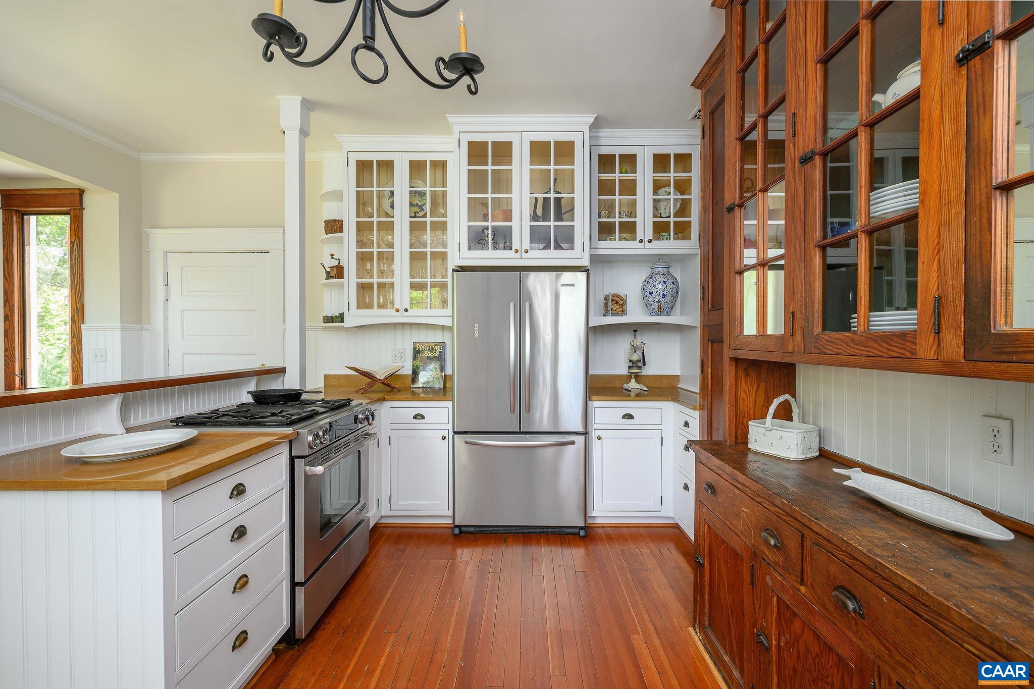 1326 Rugby Road Charlottesville, VA 22903 - Photo 16 of 65 a kitchen with stainless steel appliances granite countertop a stove and a sink