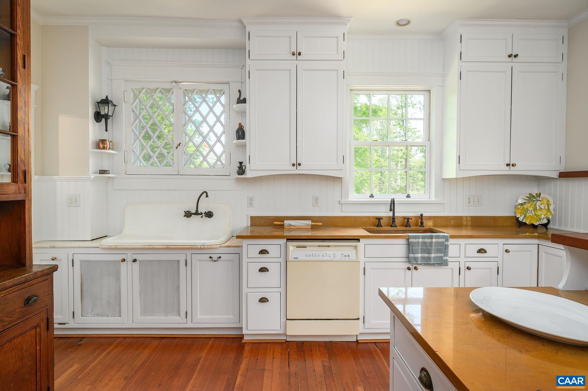1326 Rugby Road Charlottesville, VA 22903 - Photo 17 of 65 a kitchen with stainless steel appliances granite countertop a sink a stove and cabinets