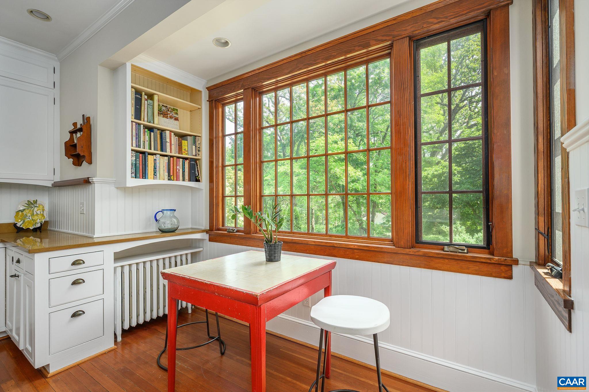 1326 Rugby Road Charlottesville, VA 22903 - Photo 18 of 65 a view of a kitchen area with furniture and wooden floor