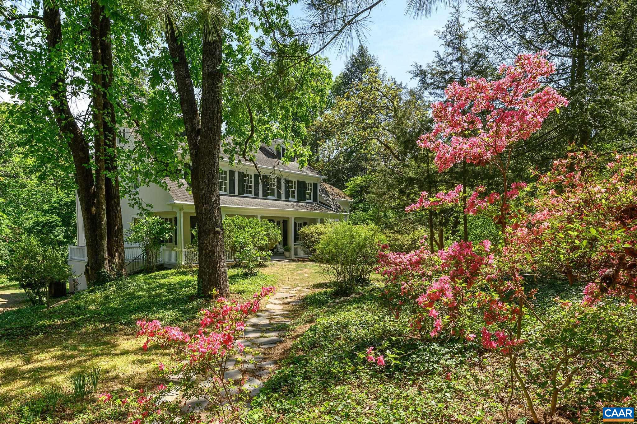 1326 Rugby Road Charlottesville, VA 22903 - Photo 2 of 65 a backyard of a house with lots of green space and garden