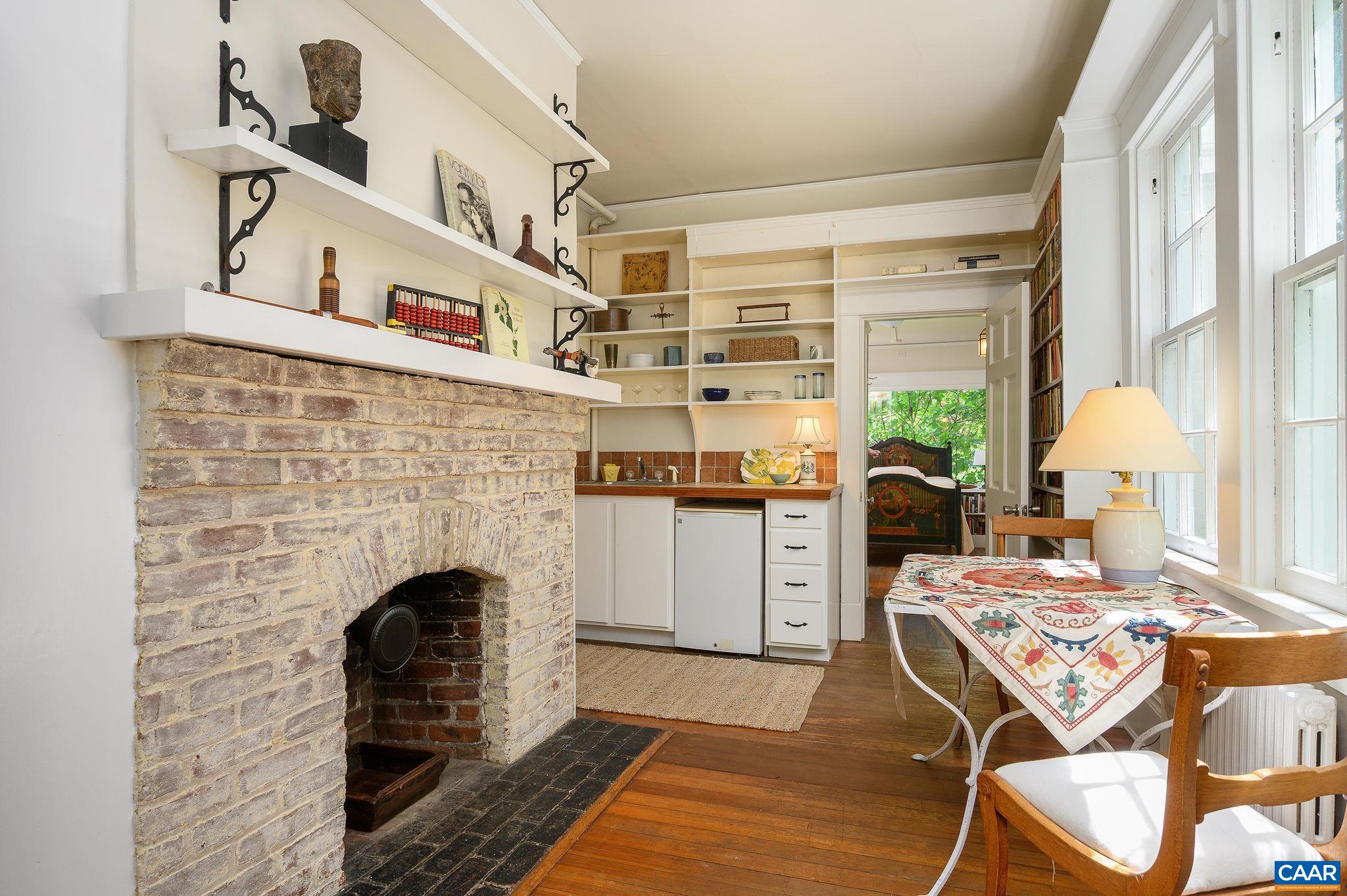 1326 Rugby Road Charlottesville, VA 22903 - Photo 22 of 65 a living room with furniture and a fireplace