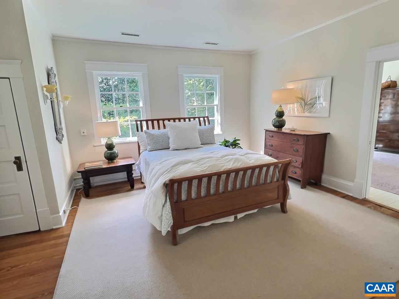1326 Rugby Road Charlottesville, VA 22903 - Photo 24 of 65 a bedroom with a bed chair and a window