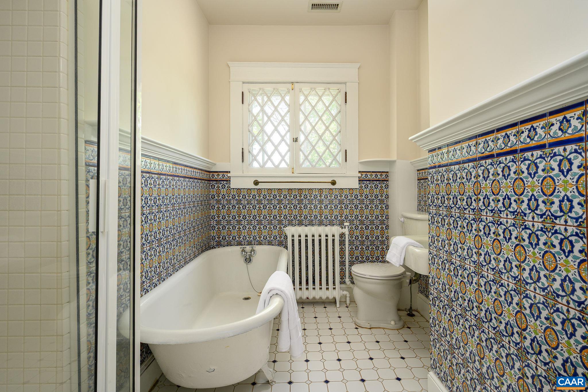 1326 Rugby Road Charlottesville, VA 22903 - Photo 31 of 65 a bathroom with a toilet and a shower curtain