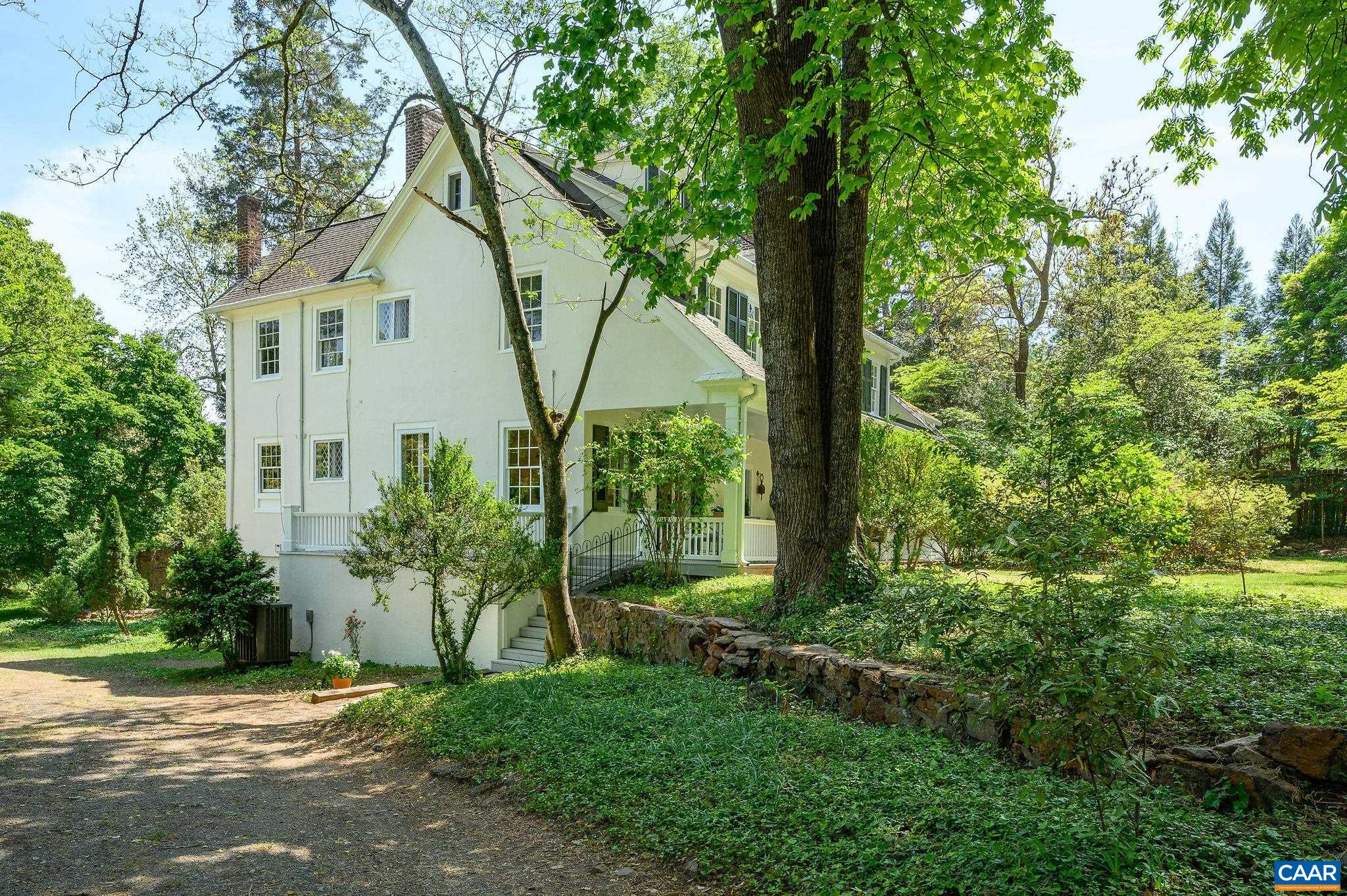 1326 Rugby Road Charlottesville, VA 22903 - Photo 48 of 65 a backyard of a house with plants and large trees