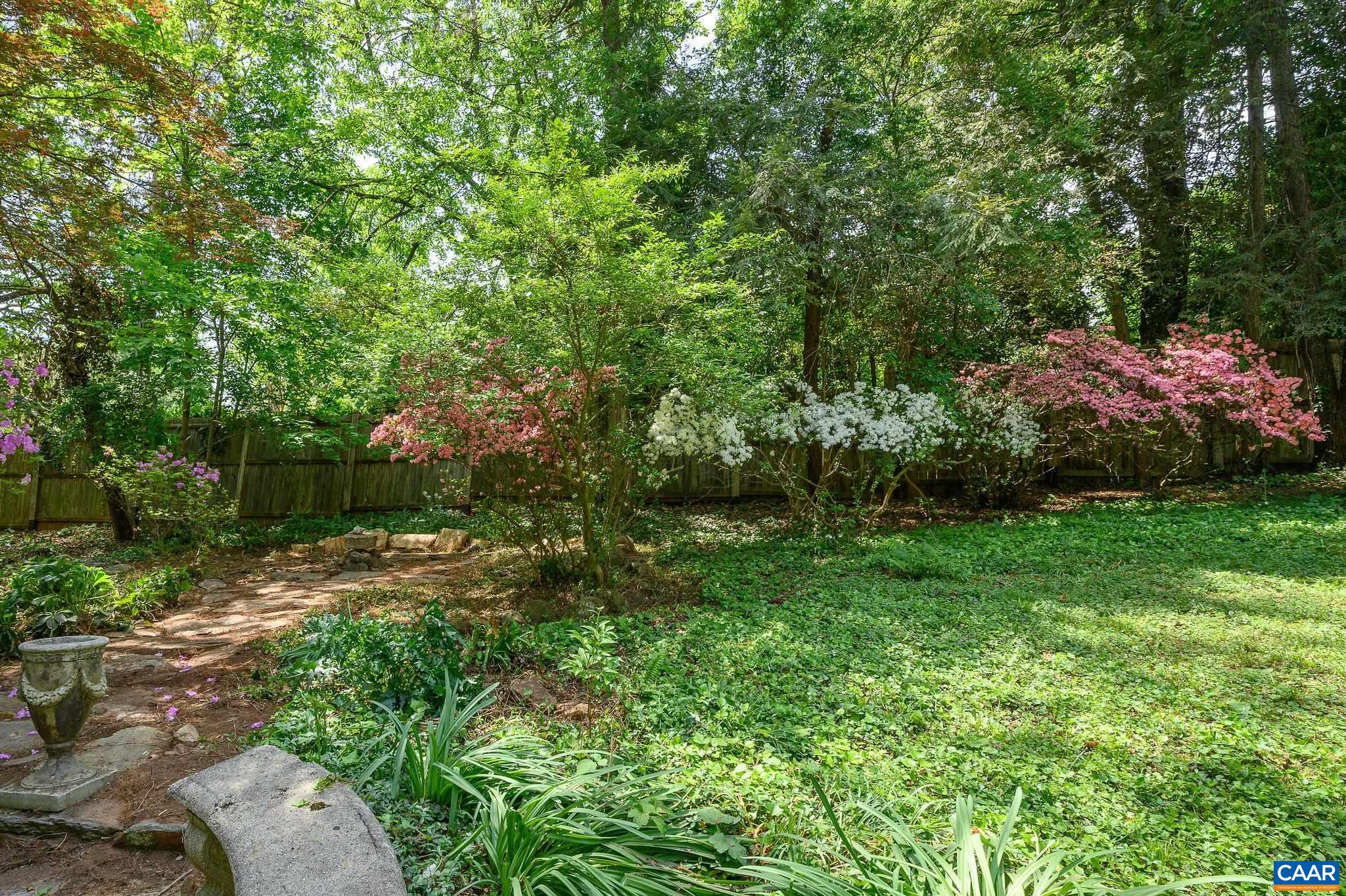 1326 Rugby Road Charlottesville, VA 22903 - Photo 56 of 65 a backyard of a house with lots of green space
