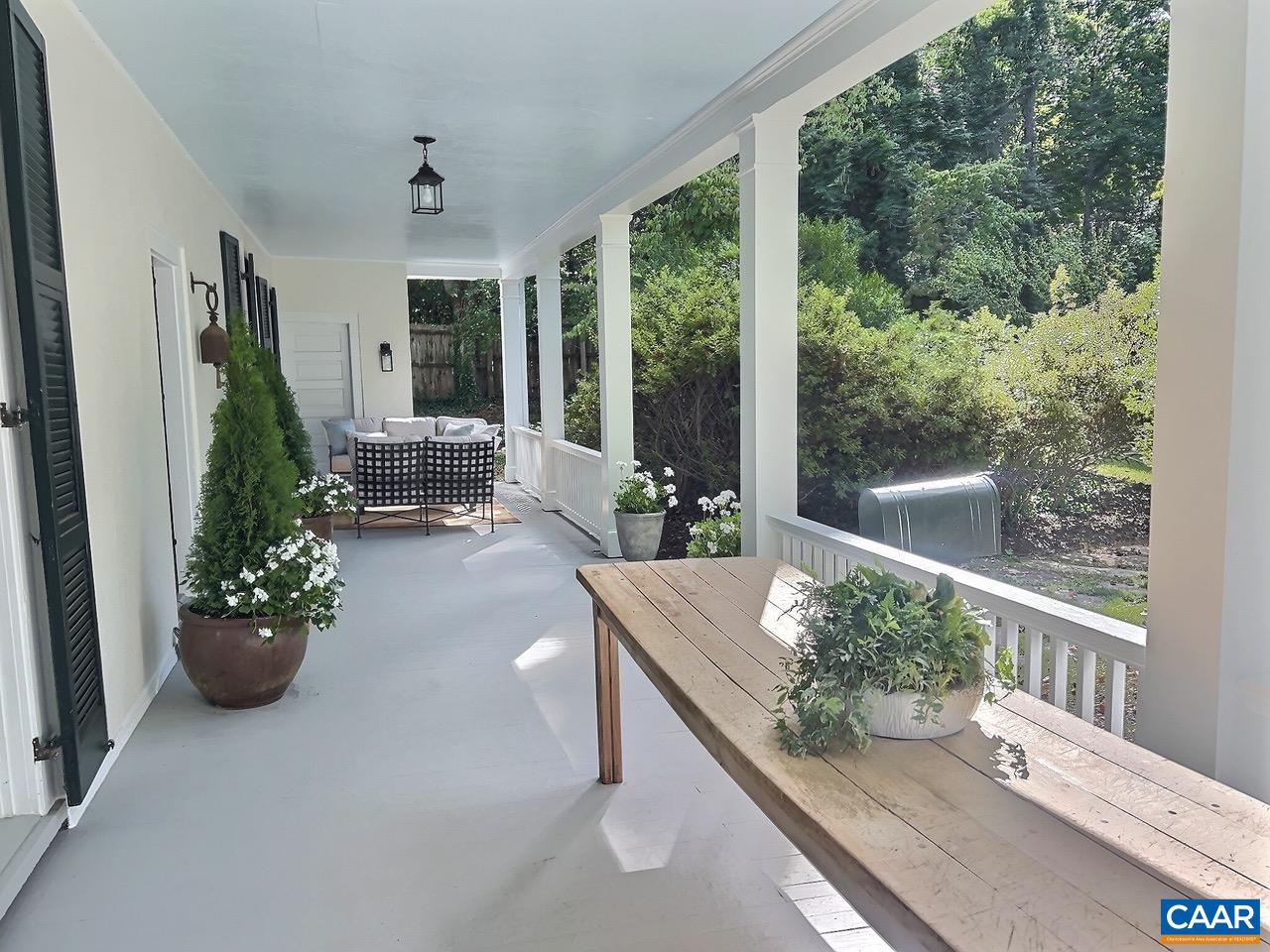 1326 Rugby Road Charlottesville, VA 22903 - Photo 6 of 65 a living room with furniture and a potted plant