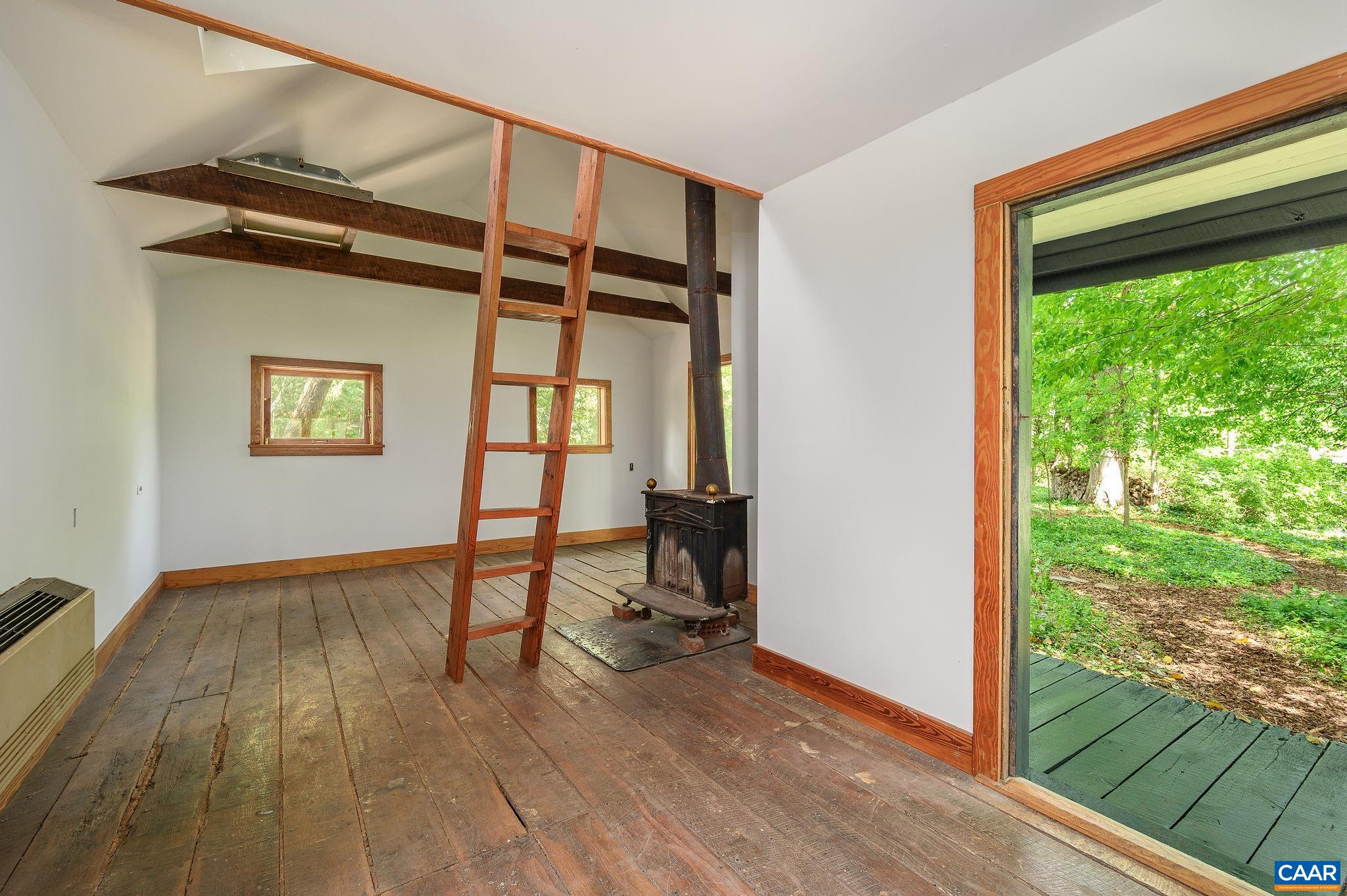 1326 Rugby Road Charlottesville, VA 22903 - Photo 61 of 65 a view of an entryway with wooden floor and a window