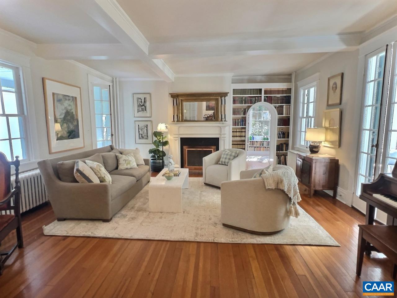1326 Rugby Road Charlottesville, VA 22903 - Photo 9 of 65 a living room with furniture and a fireplace