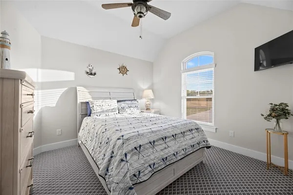 a view of a room with a ceiling fan