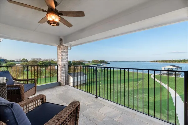 a living room with patio furniture and a fireplace