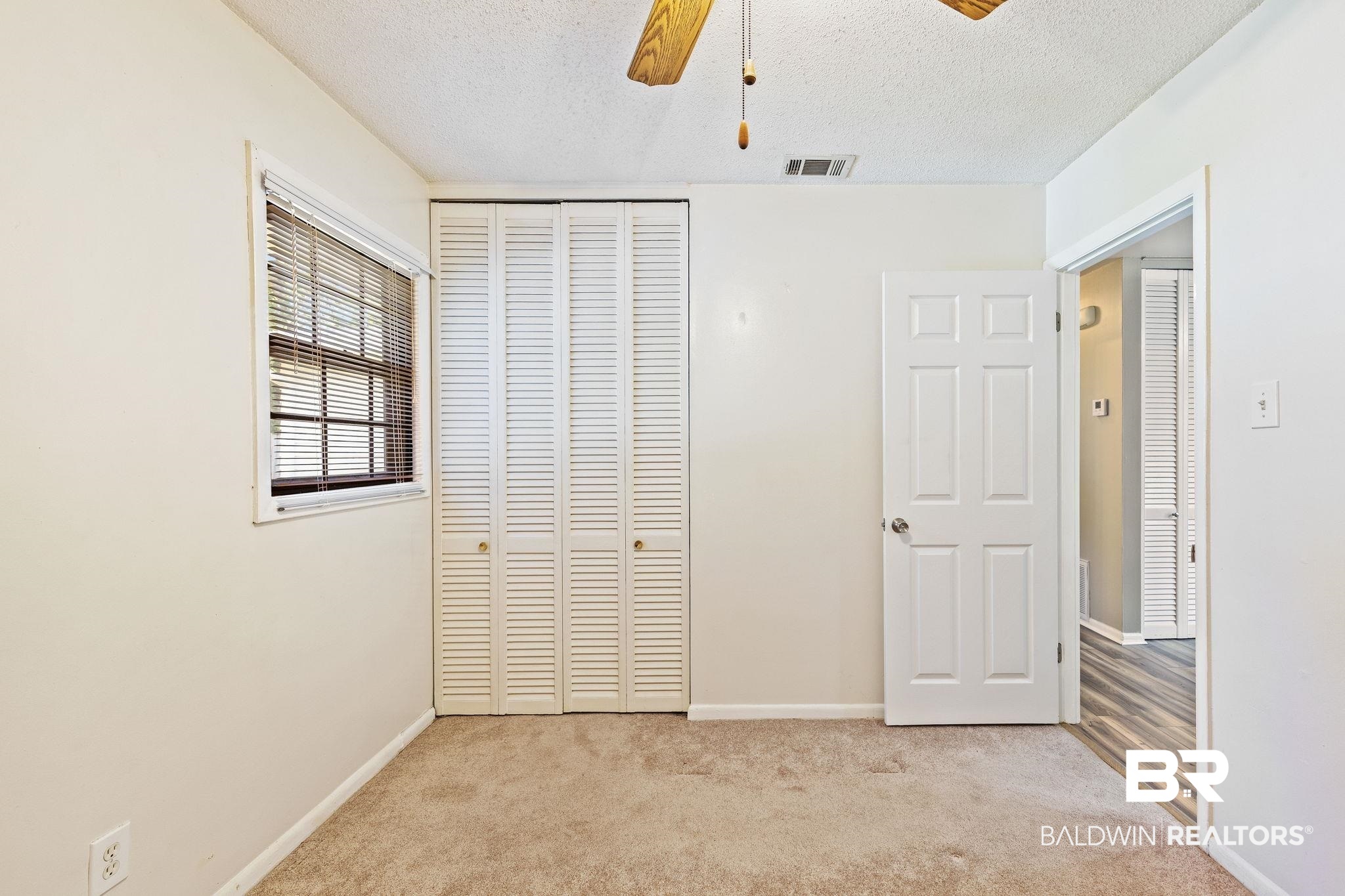4366 Barden Avenue Mobile, AL 36619 - Photo 31 of 40 Unfurnished bedroom featuring light carpet, a closet, a textured ceiling, and ceiling fan