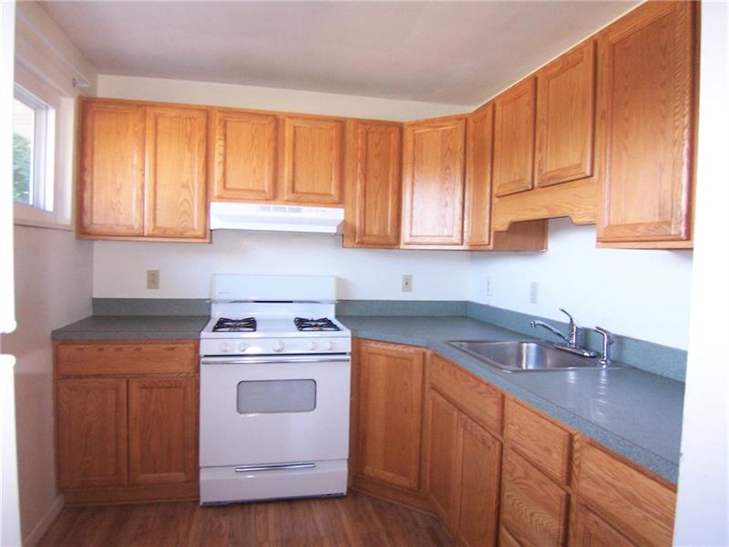 282 Ewings Mill Road Coraopolis, PA 15108 - Photo 5 of 21 Galley kitchen with oak cabinets.