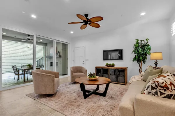 a kitchen with stainless steel appliances granite countertop a sink a stove and a refrigerator