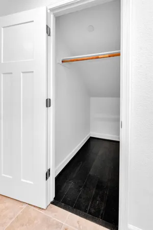 a bathroom with a sink vanity and a mirror