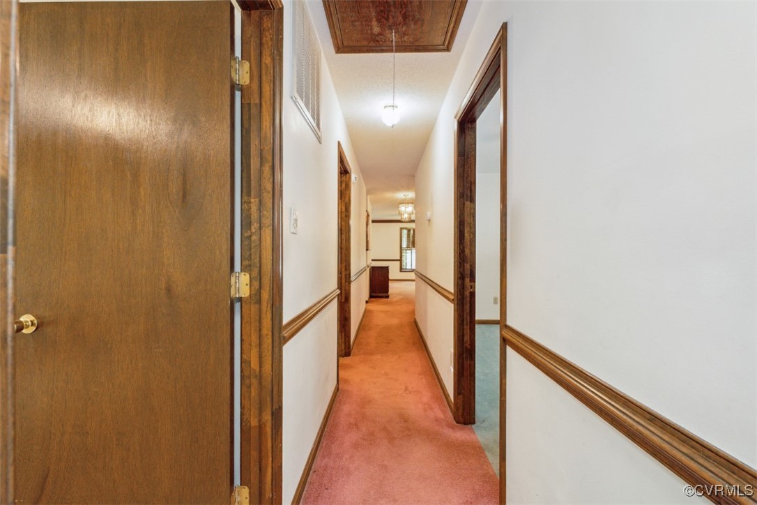 7303 Old Town Road Prince George, VA 23875 - Photo 20 of 24 Hallway with light carpet and attic access