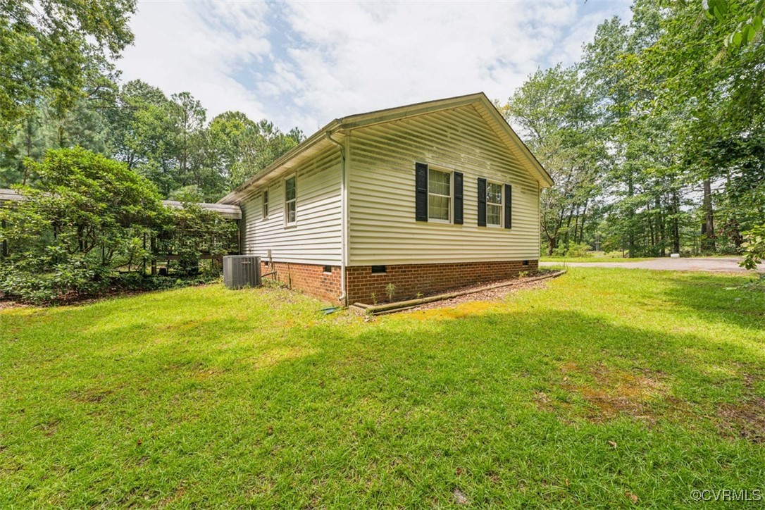 7303 Old Town Road Prince George, VA 23875 - Photo 22 of 24 View of side of home with crawl space and a yard