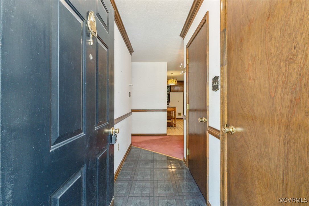 7303 Old Town Road Prince George, VA 23875 - Photo 3 of 24 Entrance foyer featuring dark flooring and a textu