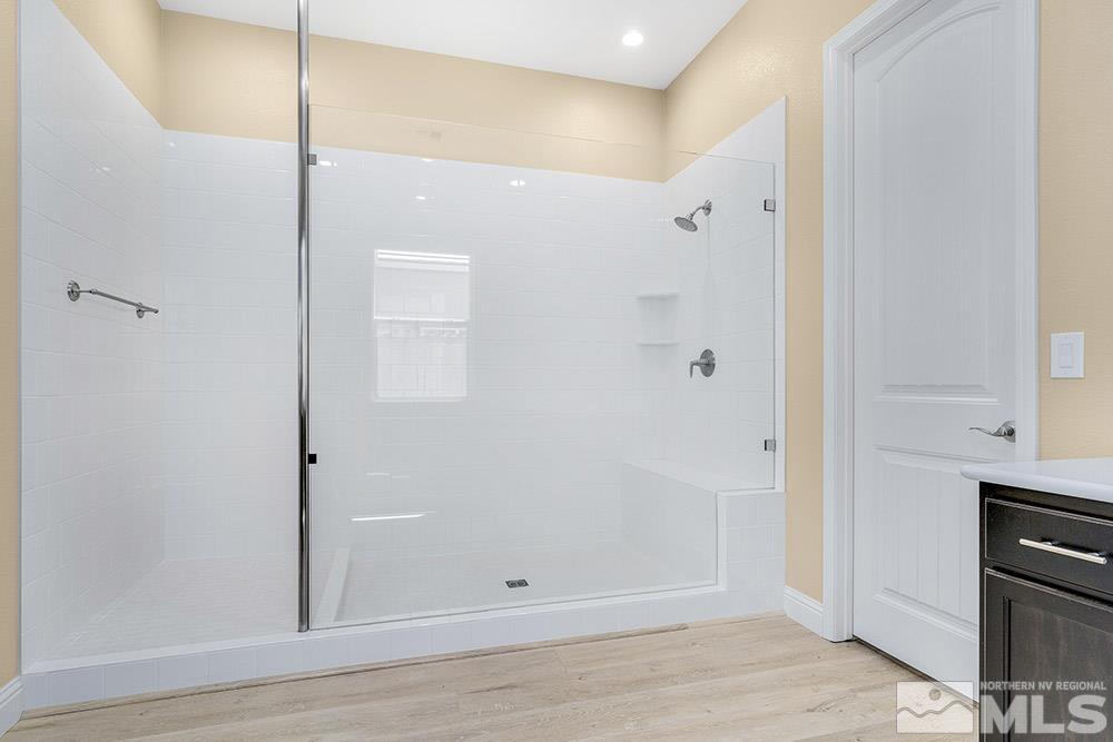 9545 Hawkshead Road Reno, NV 89521 - Photo 15 of 29 a view of a hallway with wooden floor