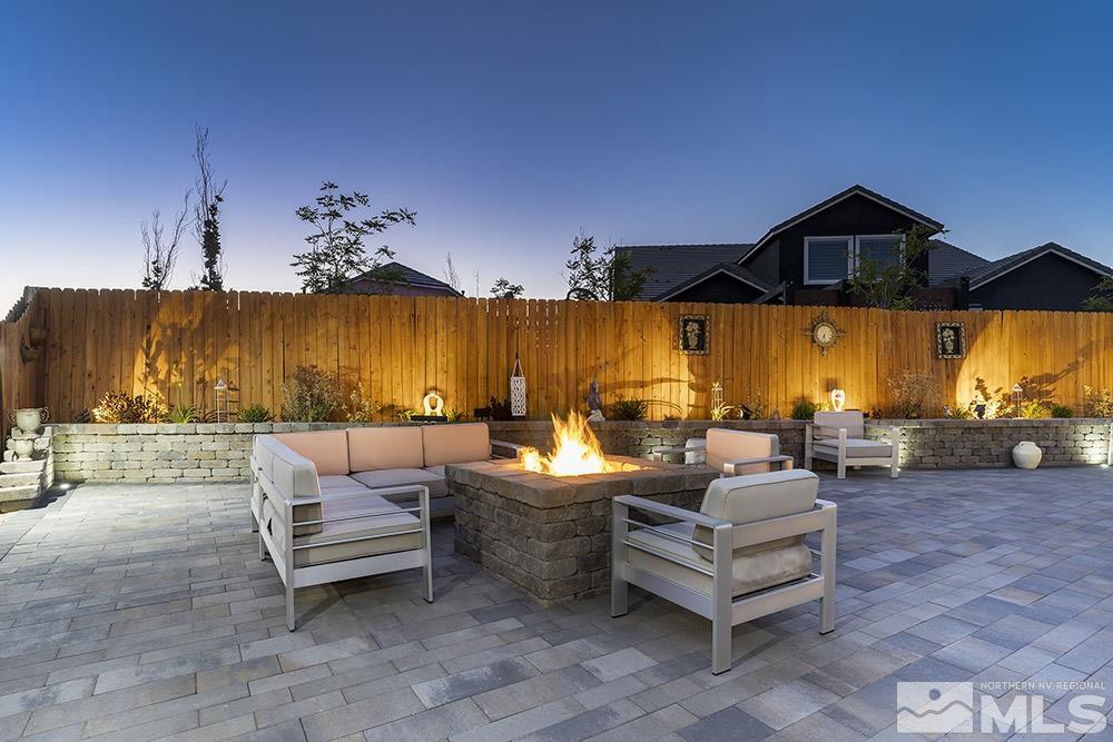 9545 Hawkshead Road Reno, NV 89521 - Photo 25 of 29 a outdoor space with patio couch and a fireplace