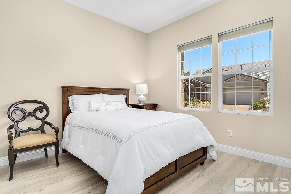 9545 Hawkshead Road Reno, NV 89521 - Photo 6 of 29 a bedroom with a bed and a window