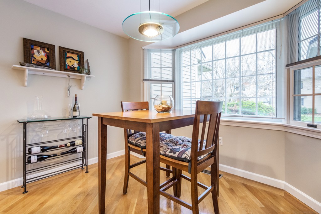 9 Powder Hill Way, Unit 9 Westborough, MA 01581 - Photo 13 of 30 a dining room with furniture and window
