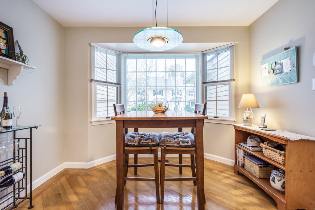 9 Powder Hill Way, Unit 9 Westborough, MA 01581 - Photo 14 of 30 a view of a dining room with furniture window and wooden floor