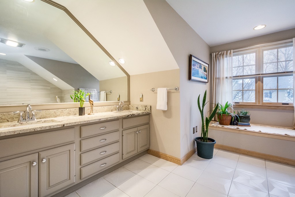9 Powder Hill Way, Unit 9 Westborough, MA 01581 - Photo 20 of 30 a bathroom with a tub sink and mirror