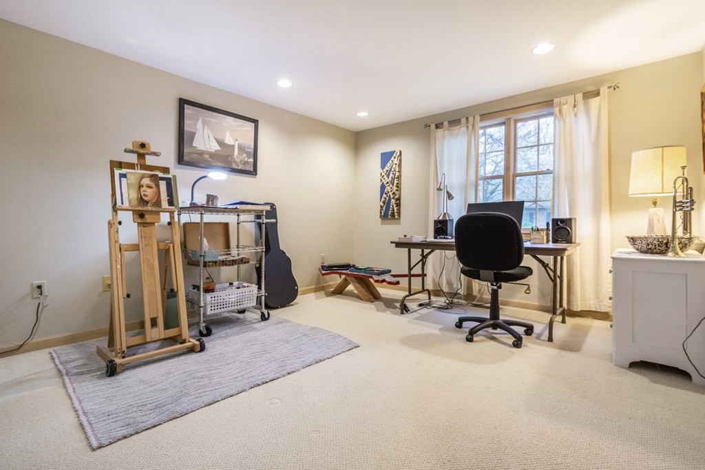 9 Powder Hill Way, Unit 9 Westborough, MA 01581 - Photo 24 of 30 a view of a livingroom with workspace and a window