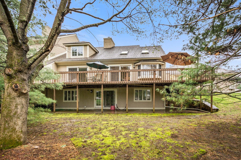 9 Powder Hill Way, Unit 9 Westborough, MA 01581 - Photo 28 of 30 a front view of a house with a garden