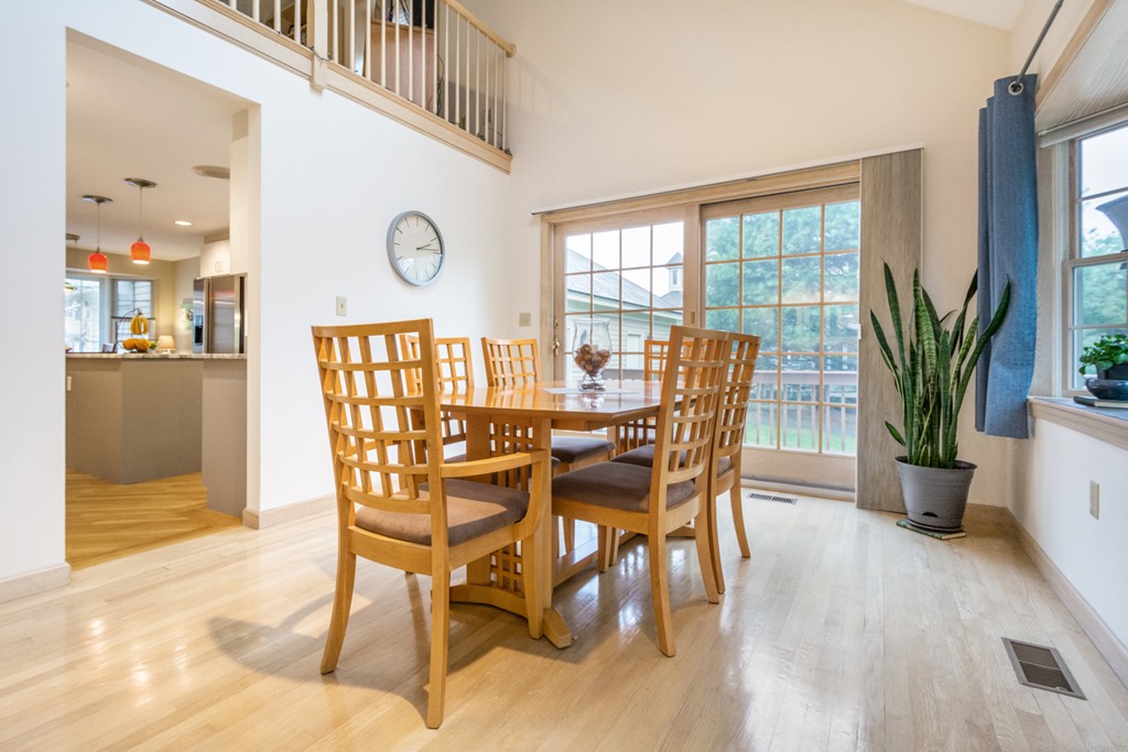 9 Powder Hill Way, Unit 9 Westborough, MA 01581 - Photo 8 of 30 a dining room with furniture potted plants and wooden floor