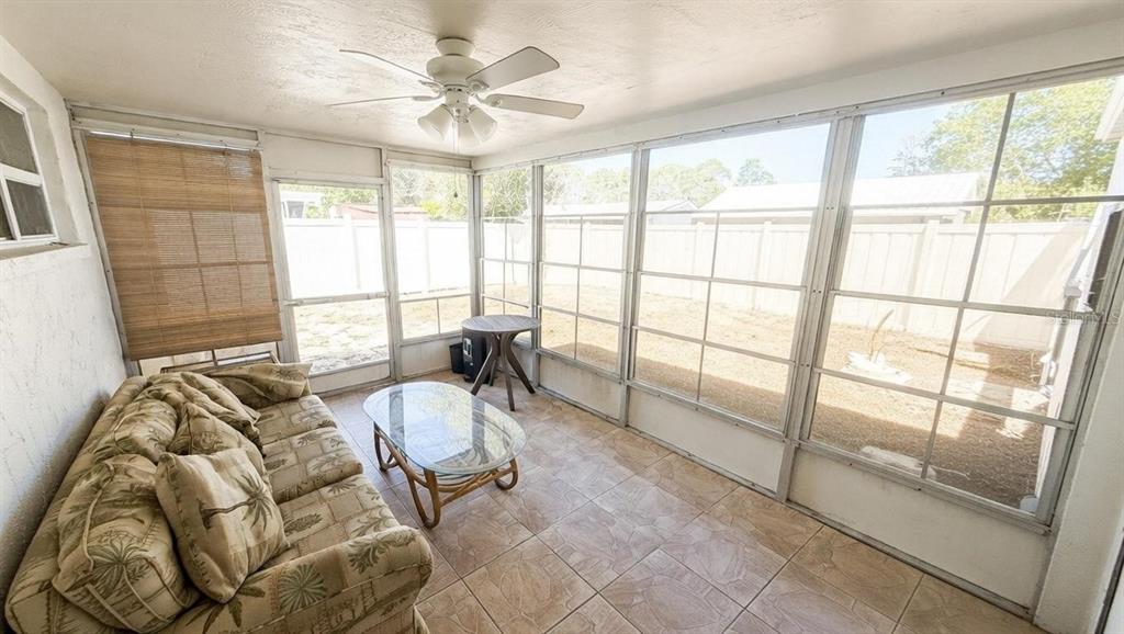 4033 Newcastle Drive New Port Richey, FL 34652 - Photo 11 of 12 a living room with furniture and a large window