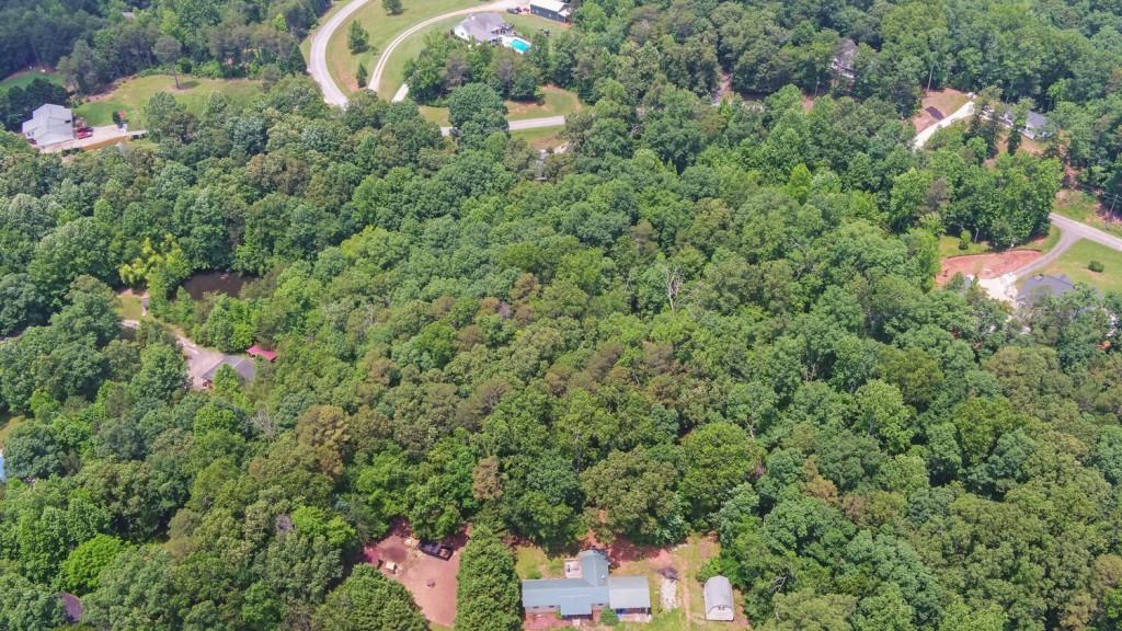6755 Jake Kemp Road Murrayville, GA 30564 - Photo 5 of 22 an aerial view of a house with a yard and outdoor space