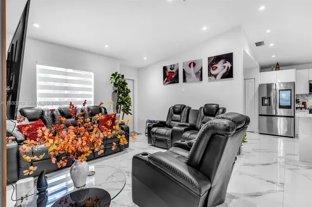 a living room with furniture toys and a large window