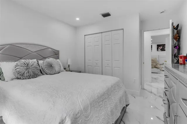 a bedroom with a bed and a cabinets